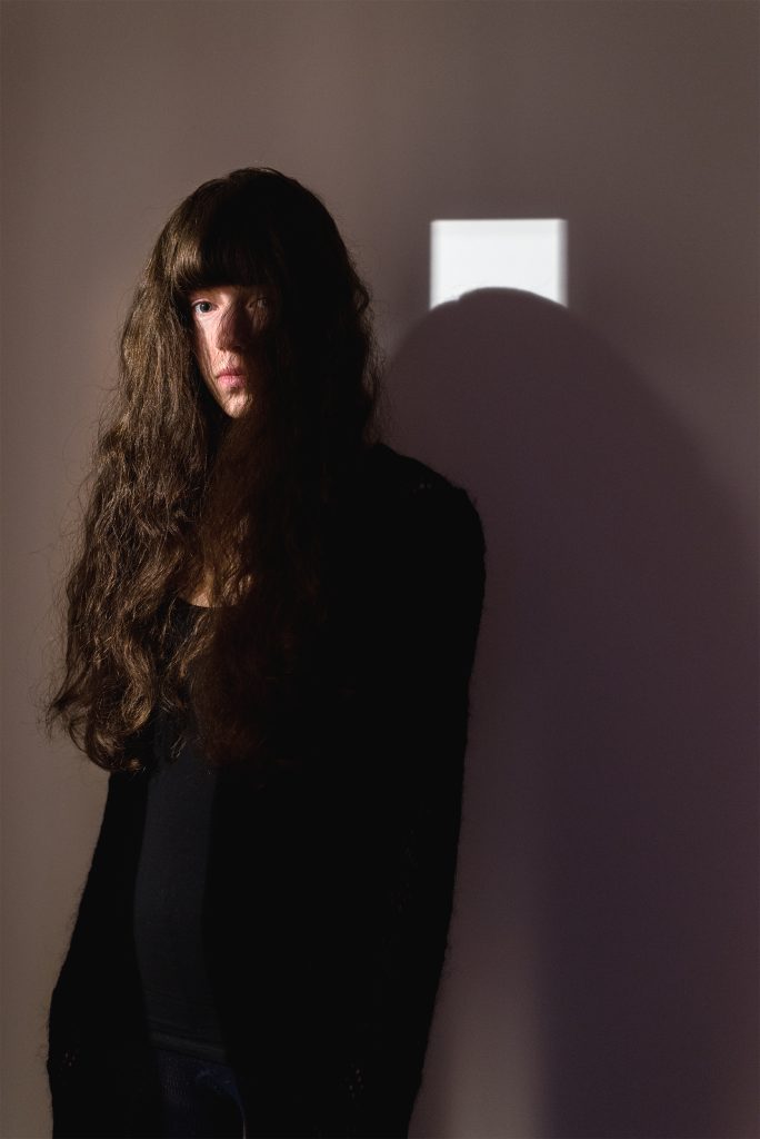 Portrait of a long-haired Anna Dust. A winning image in the Portrait of Britain 2015 competition
