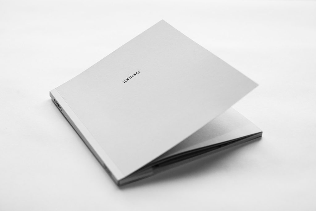 The Sentience book photographed on a white background.