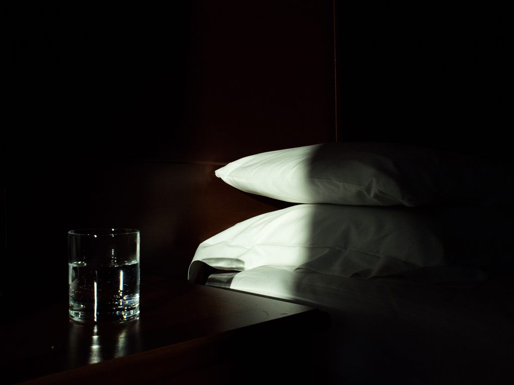 Photograph of two pillows in the hotel room.