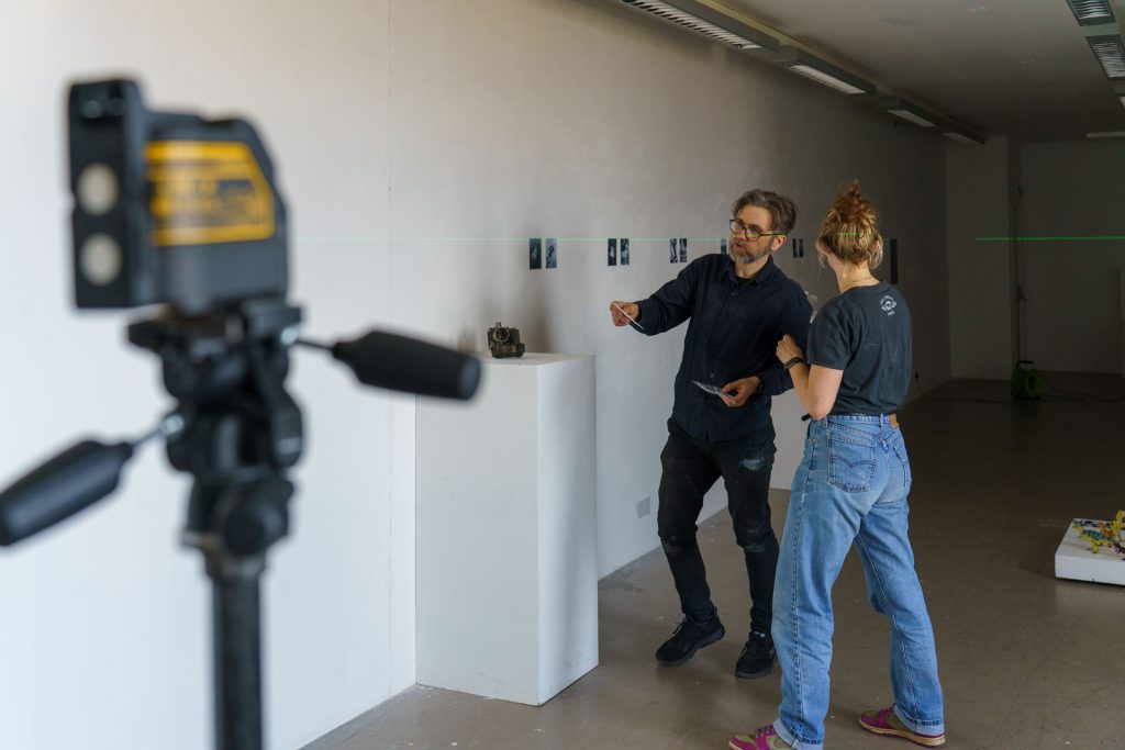 Wojtek and Emiliya mounting the work